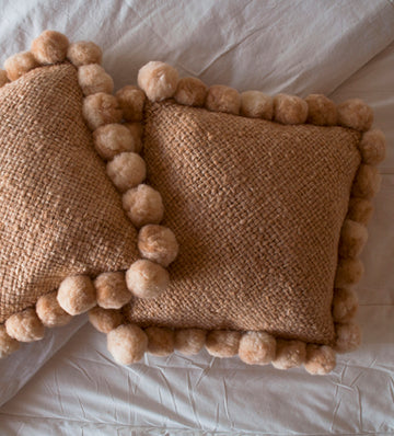 handwoven natural wool pom pom throw cushion beige